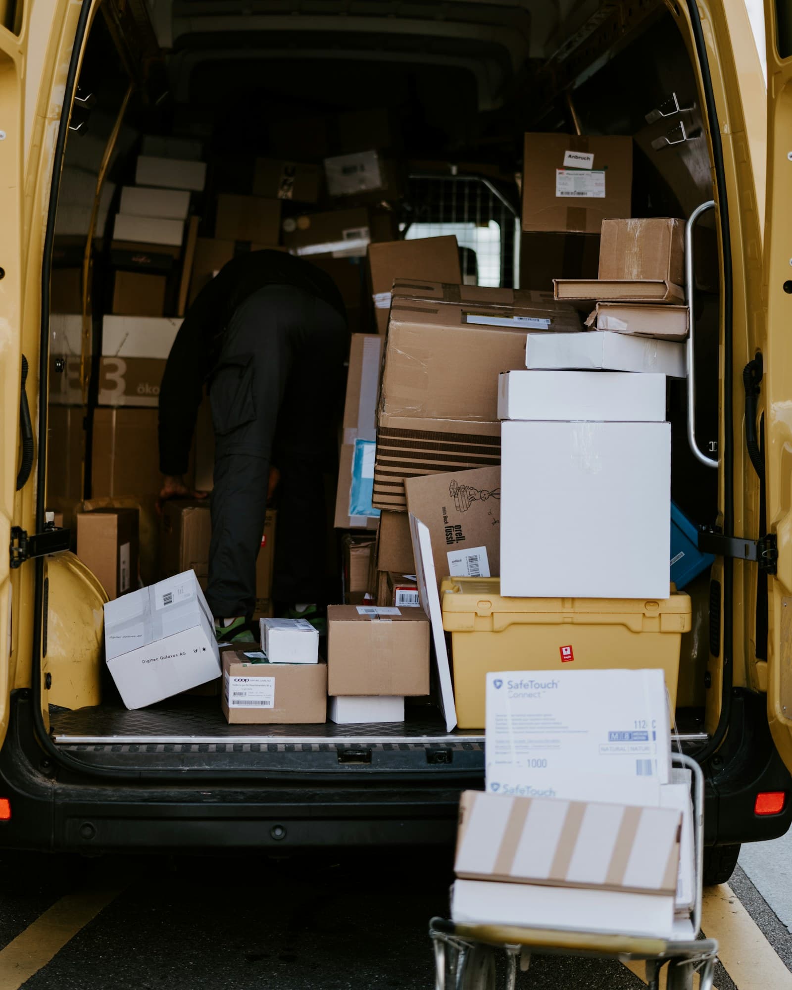 Boxes being loaded into a delivery van