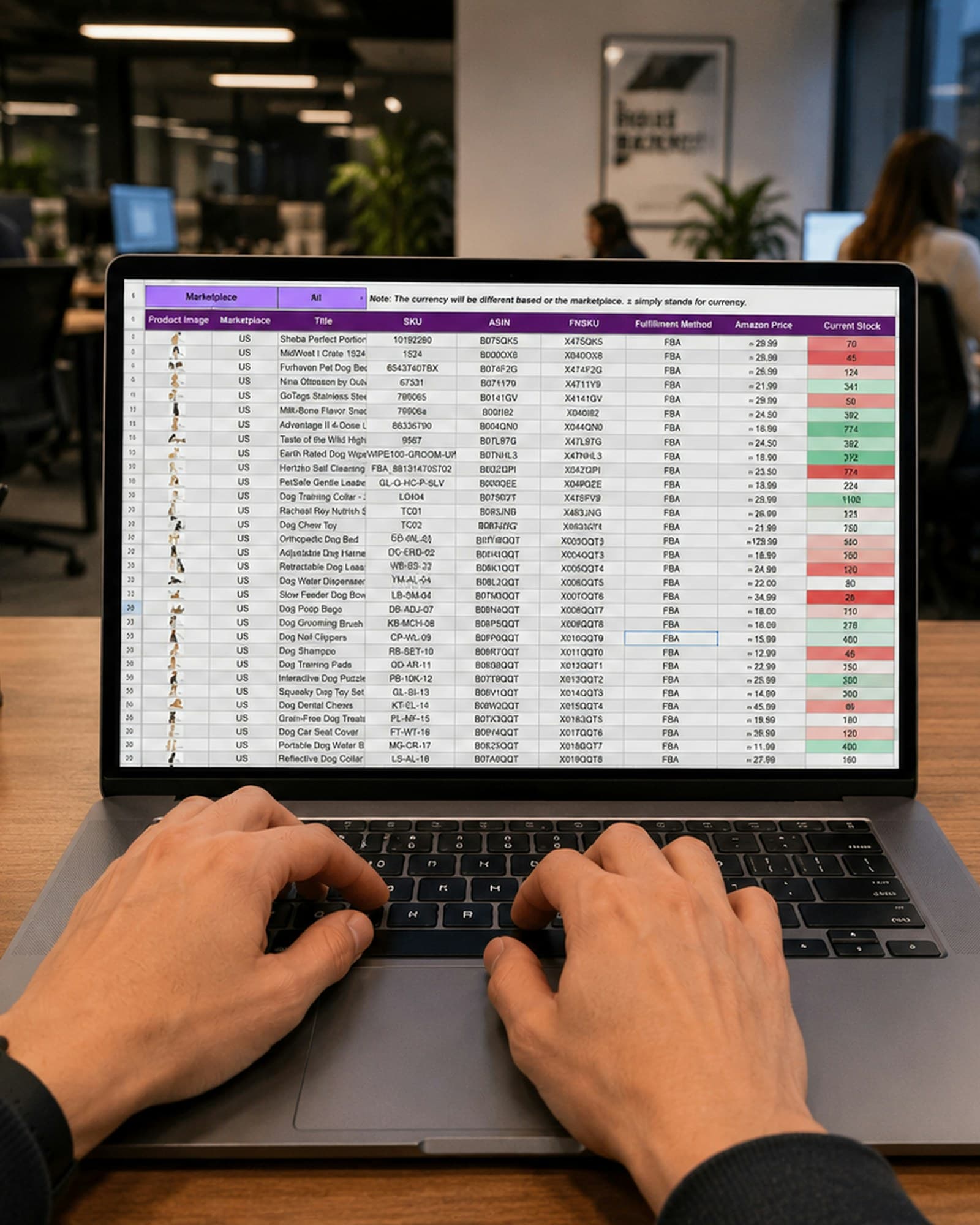 Hands typing on a laptop showing a spreadsheet